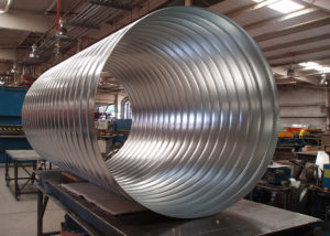 Spiral Pipe | We fabricate our own spiral pipe and fittings in both single and double wall configurations. This allows us to drastically reduce the time for fabrication and installation on your project.
