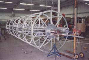 Fiberglass Pipe Mandrel | We fabricated this custom pipe mandrel for a fiberglass pipe manufacturer. We made several different sizes of the mandrels for their manufacturing needs. The mandrels incorporated a release mechanism that allows the mandrel to be collapsed slightly so it can be removed from the fiberglass pipe once it's formed.