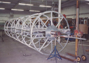 Fiberglass Pipe Mandrel | We fabricated this custom pipe mandrel for a fiberglass pipe manufacturer. We made several different sizes of the mandrels for their manufacturing needs. The mandrels incorporated a release mechanism that allows the mandrel to be collapsed slightly so it can be removed from the fiberglass pipe once it's formed.